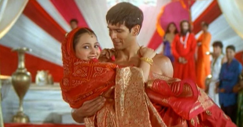 indian pop music representation by milind carrying woman in marriage