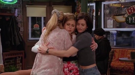 rachels phoebe and monica hugging each other in friends