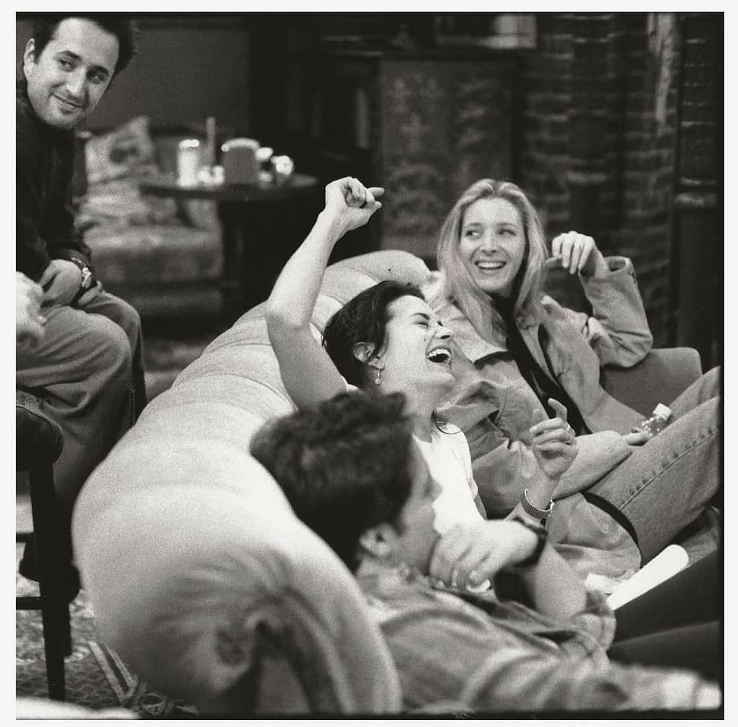 friends cast like monica and barry laughing while just before shoot begin