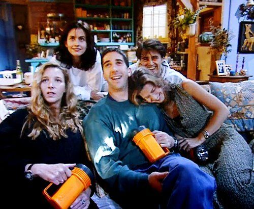 friends cast laughing and enjoying backstage photo