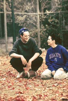 monica and chandler chilling out in friends sets while playing football