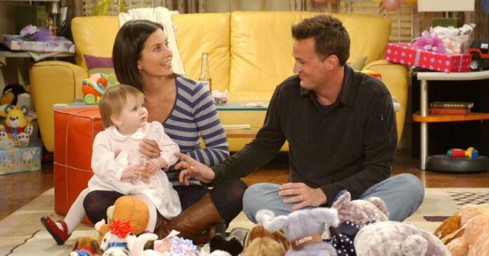 chandler and monica playing with emma the baby from friends