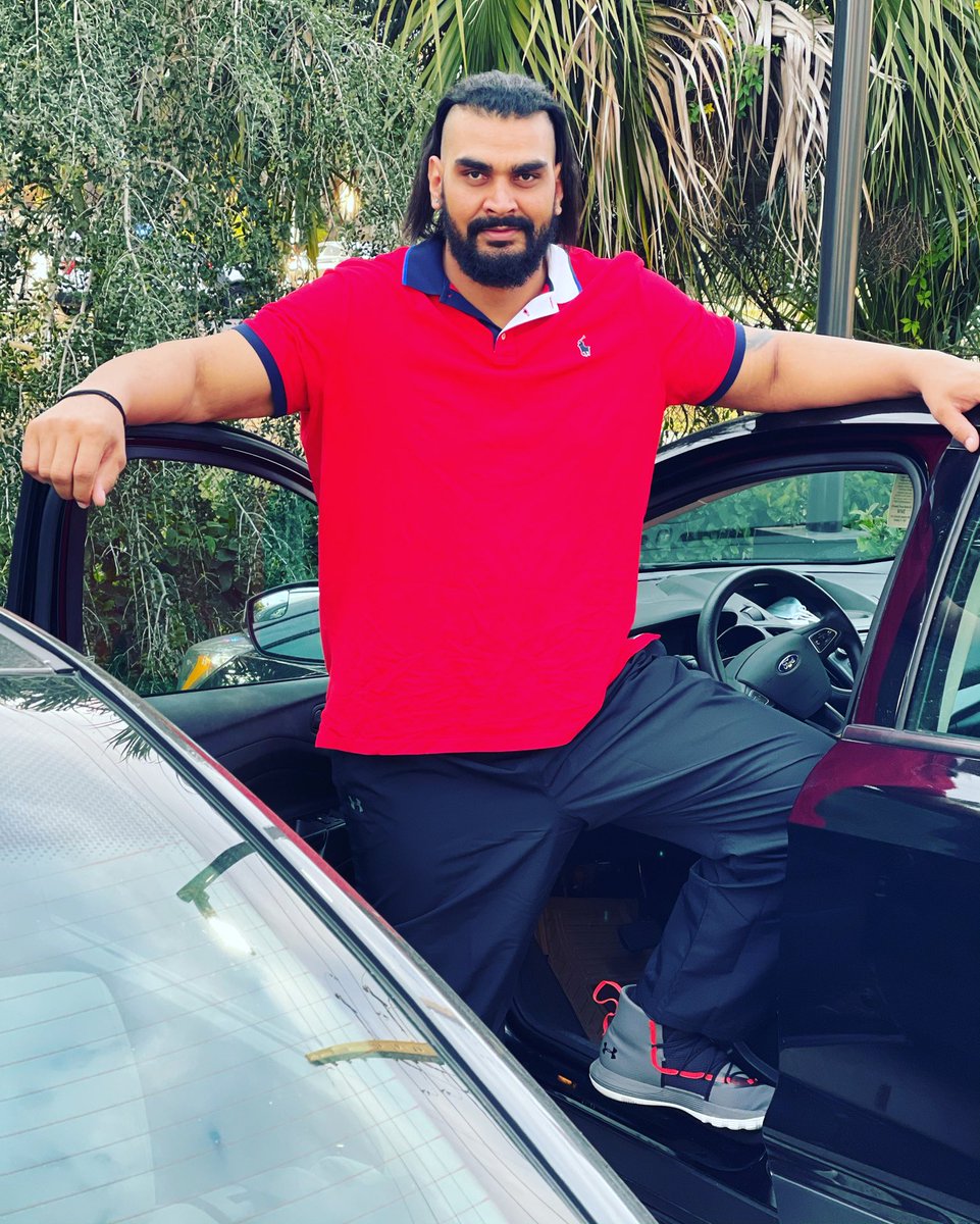 Giant Zanjeer Indian wrestler with a car