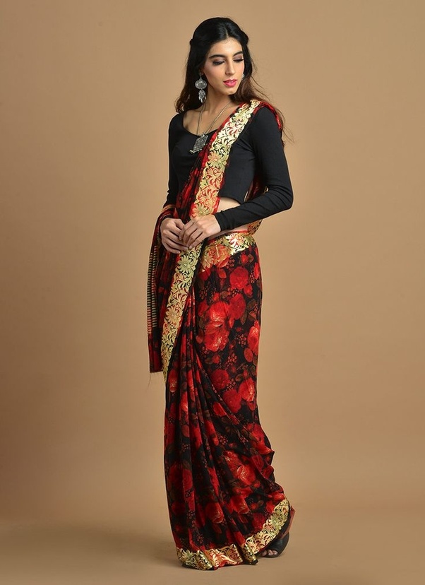 colour contrast saree with a complimenting background a traditional saree pose