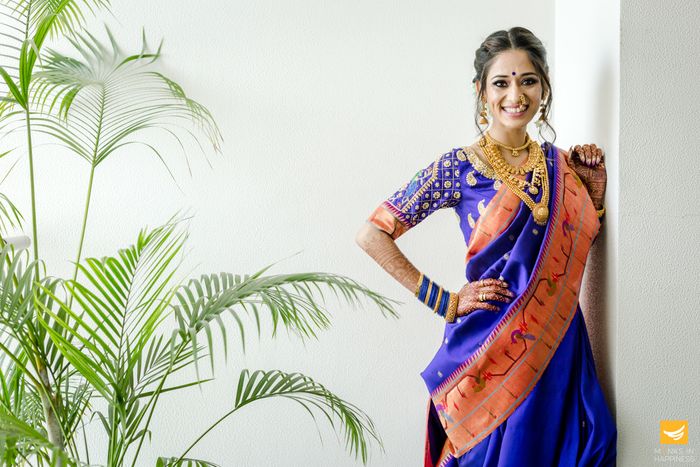 photoshoot while wearing blue saree in a light background