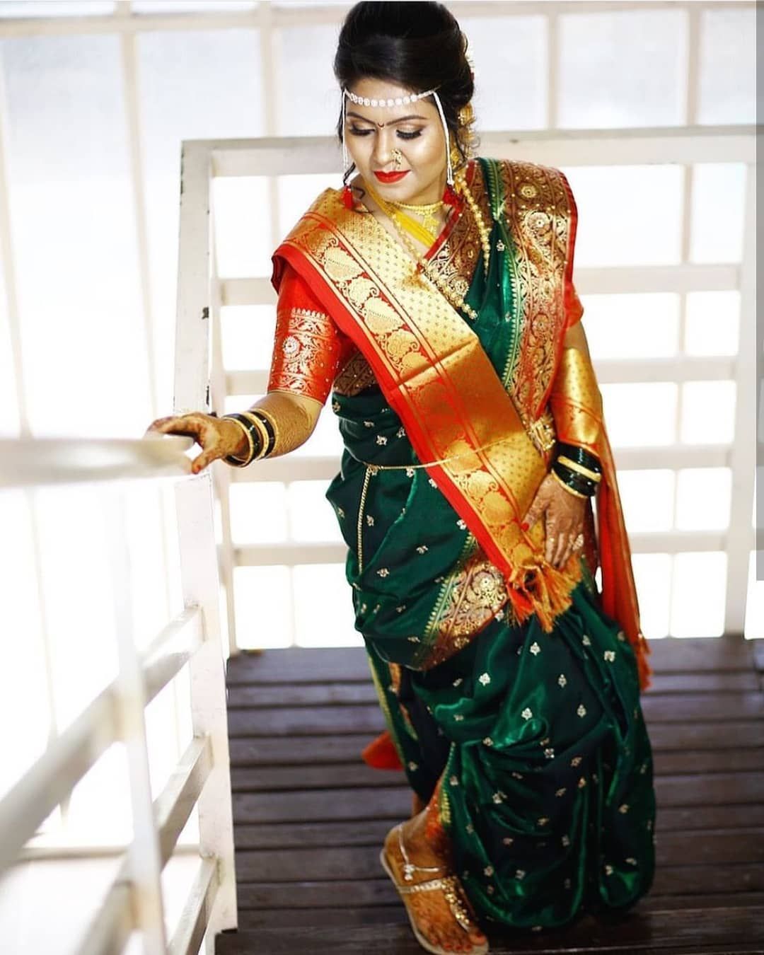 posing on the stairs with a traditional saree