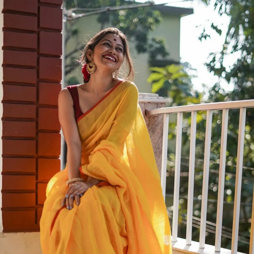 Sit and smile saree pose