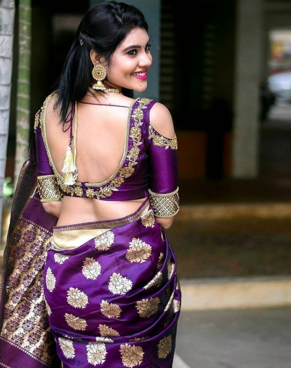 Backless Saree is one of the evergreen saree poses