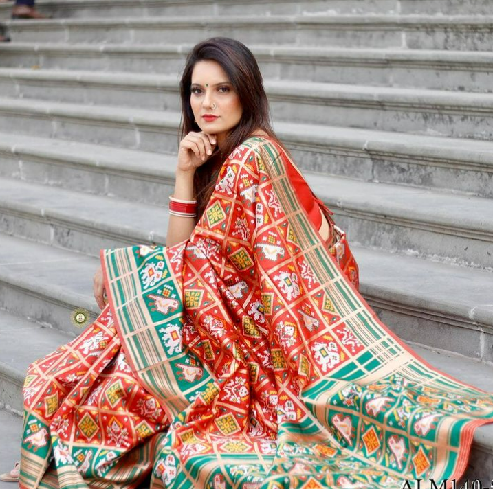 the perfect saree pose is to sit on stairs elegantly