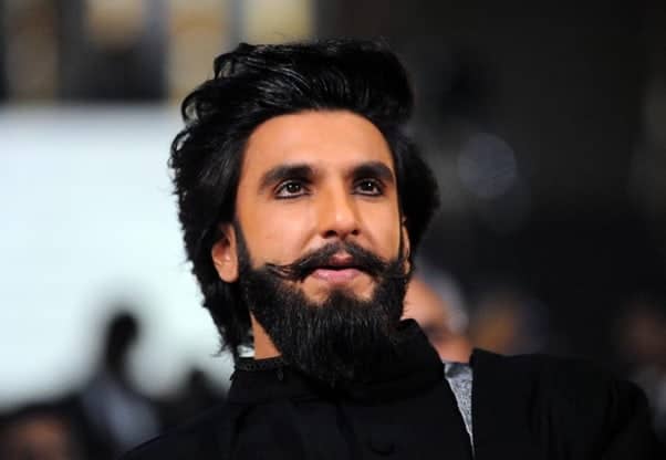 Ranveer Singh in black suit with long hair