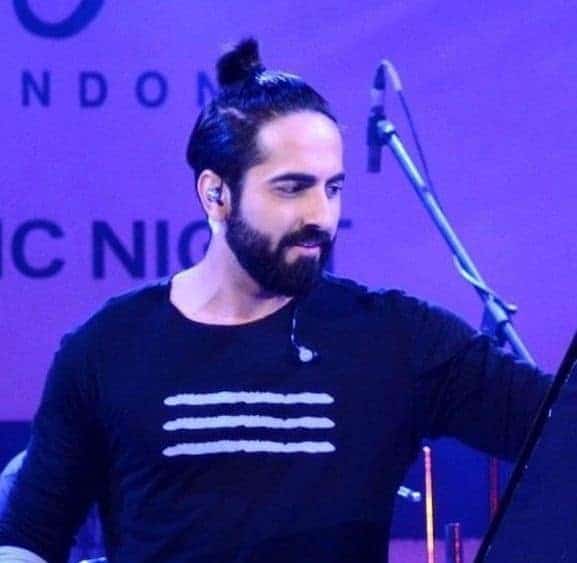 ayushmann khurran in man bun in a concert