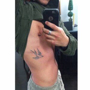 small tattoo on rib cage