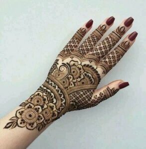 Contrasting full hand mehndi design