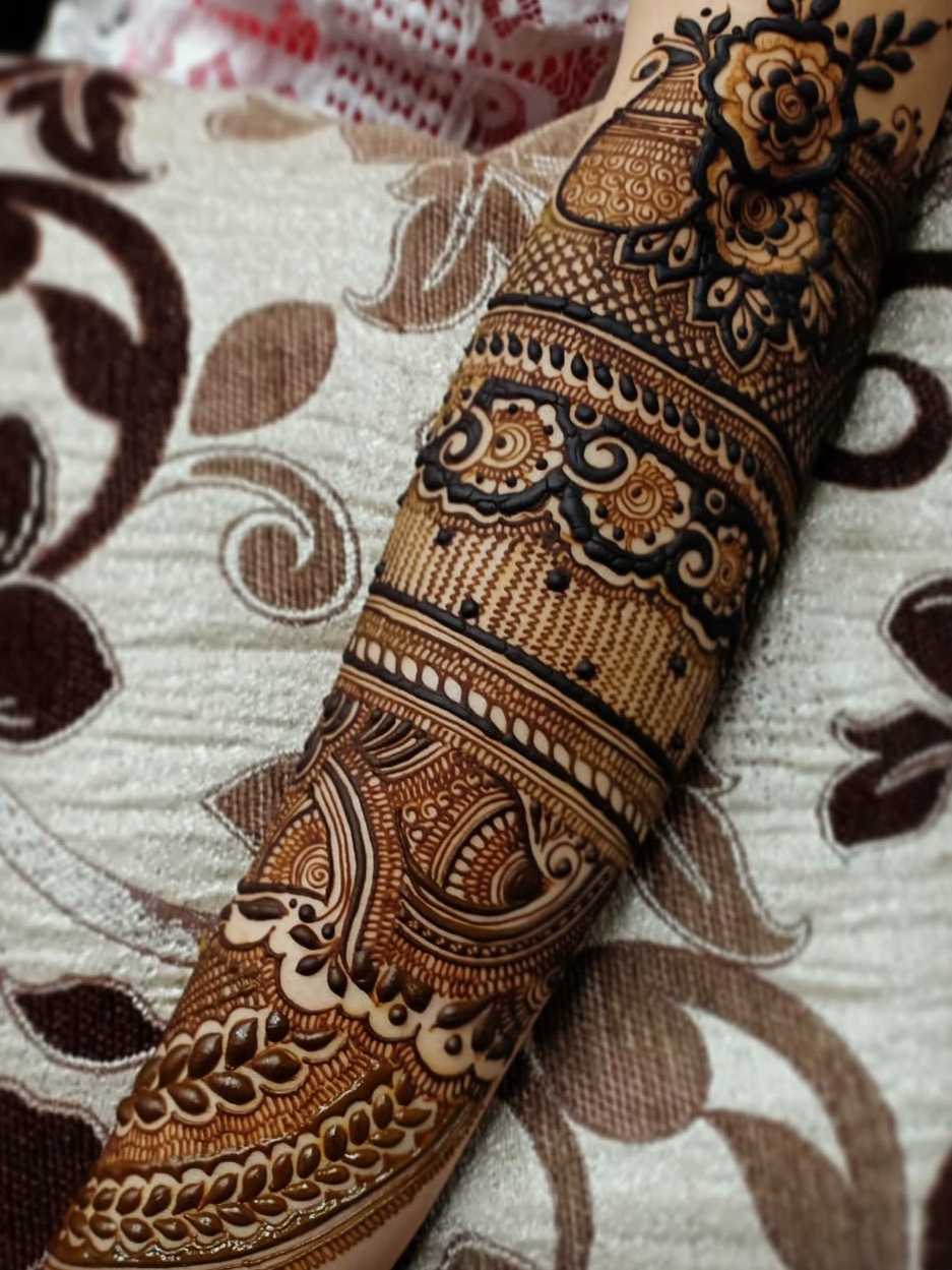 detailed back hand forearm mehndi design