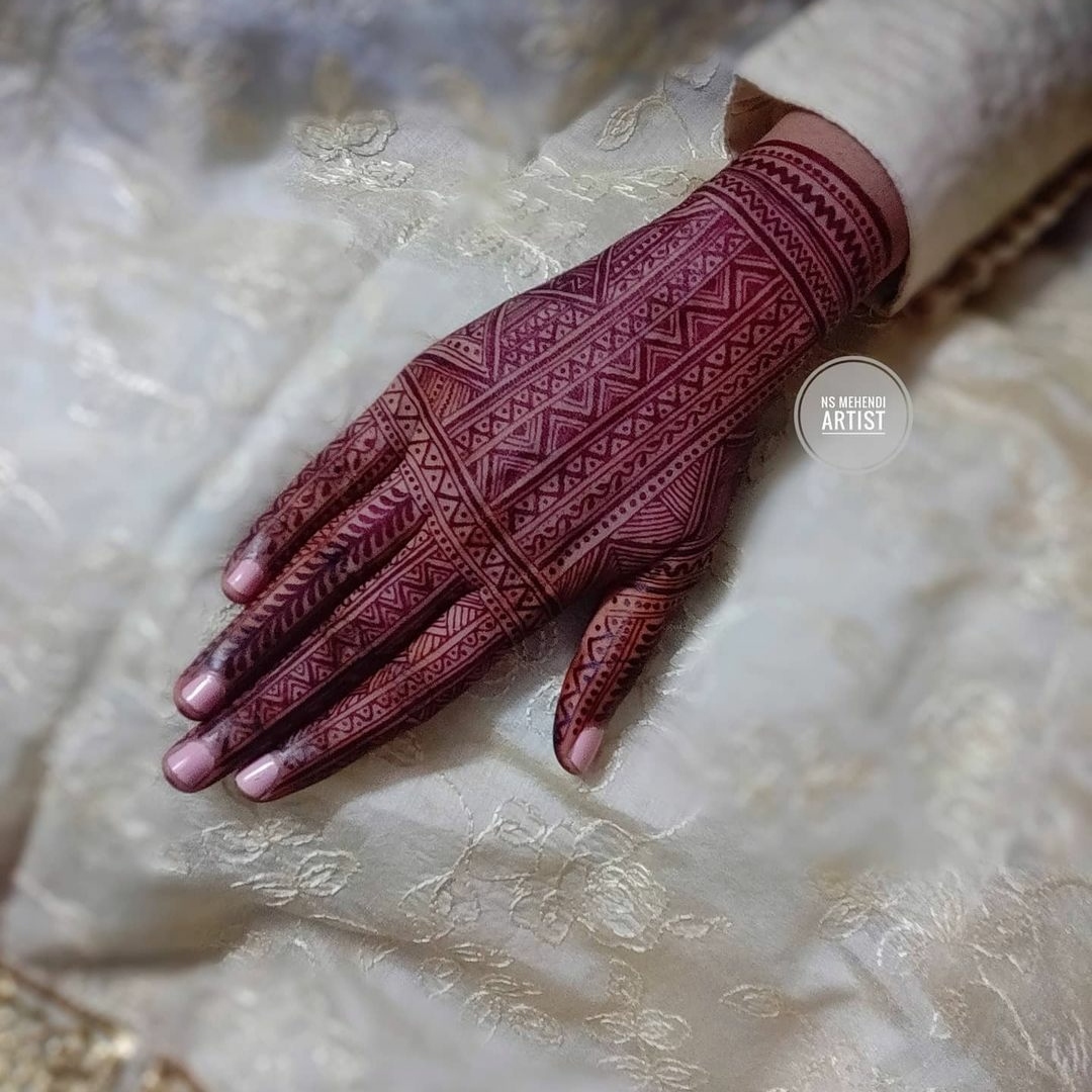 detailed full back hand mehendi design for wedding