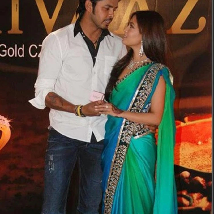 Sreesanth and Riya looking at each other