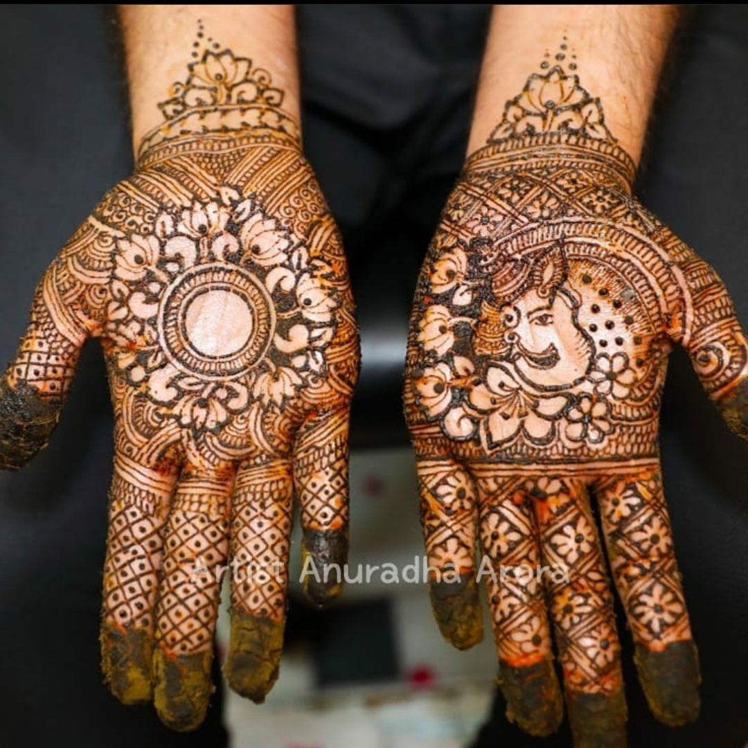 Ganesh design by henna on hands