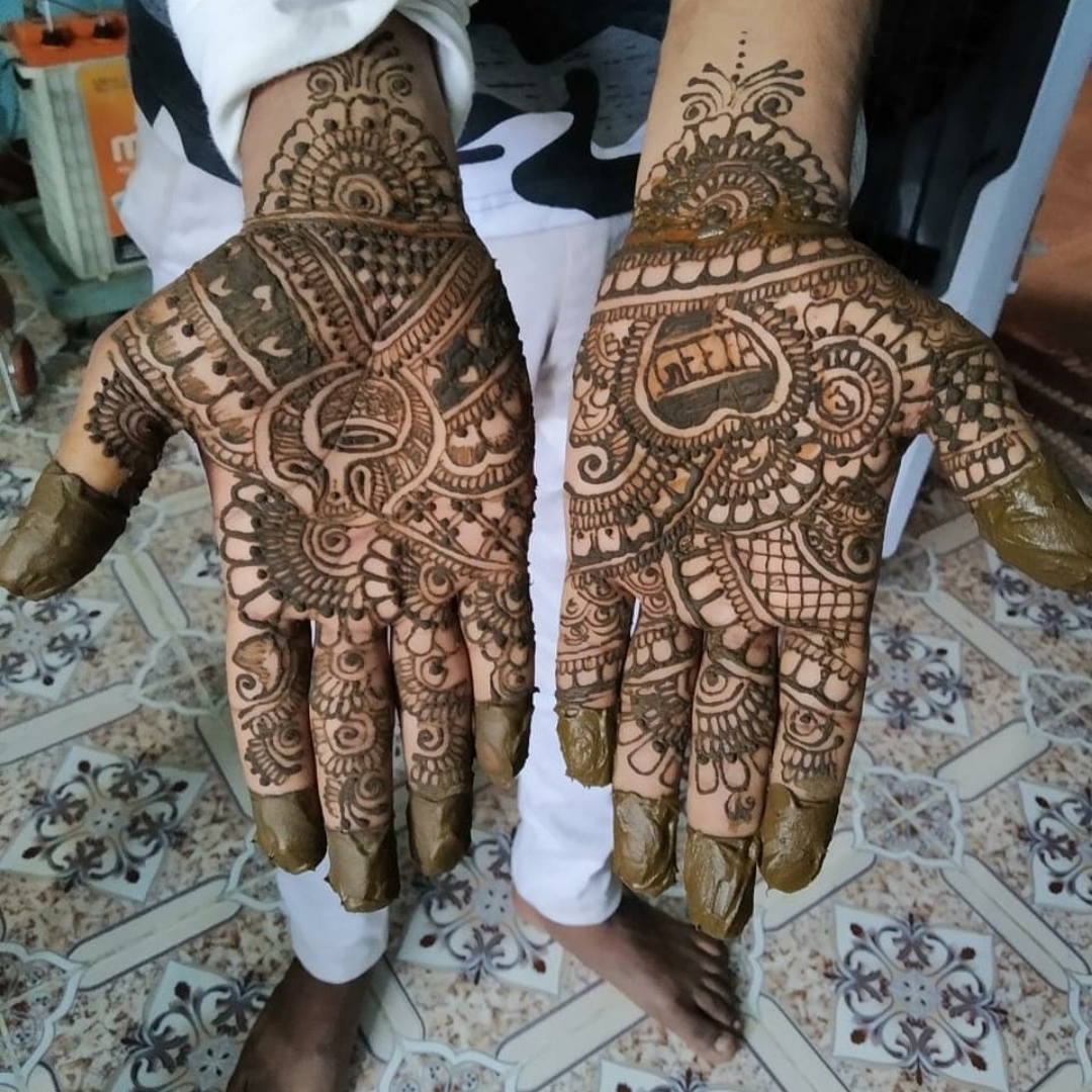 Detailed and full front hand bridal mehndi design