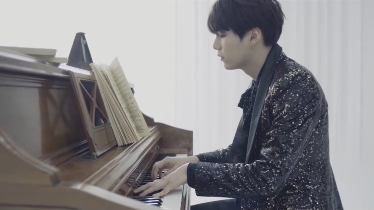 suga playing piano