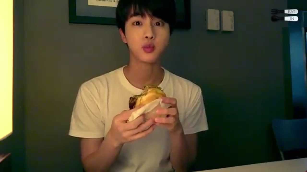 Jin eating burger