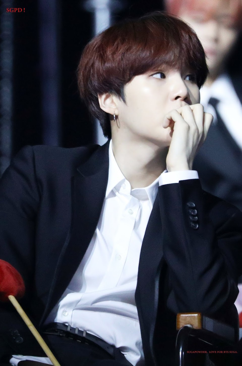 Suga biting nails