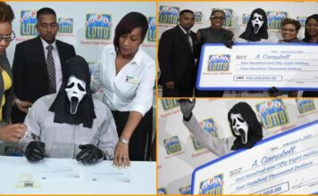 Lottery winner covers face with mask while collecting money to hide from relatives Lottery winner covers face with mask while collecting money to hide from relatives